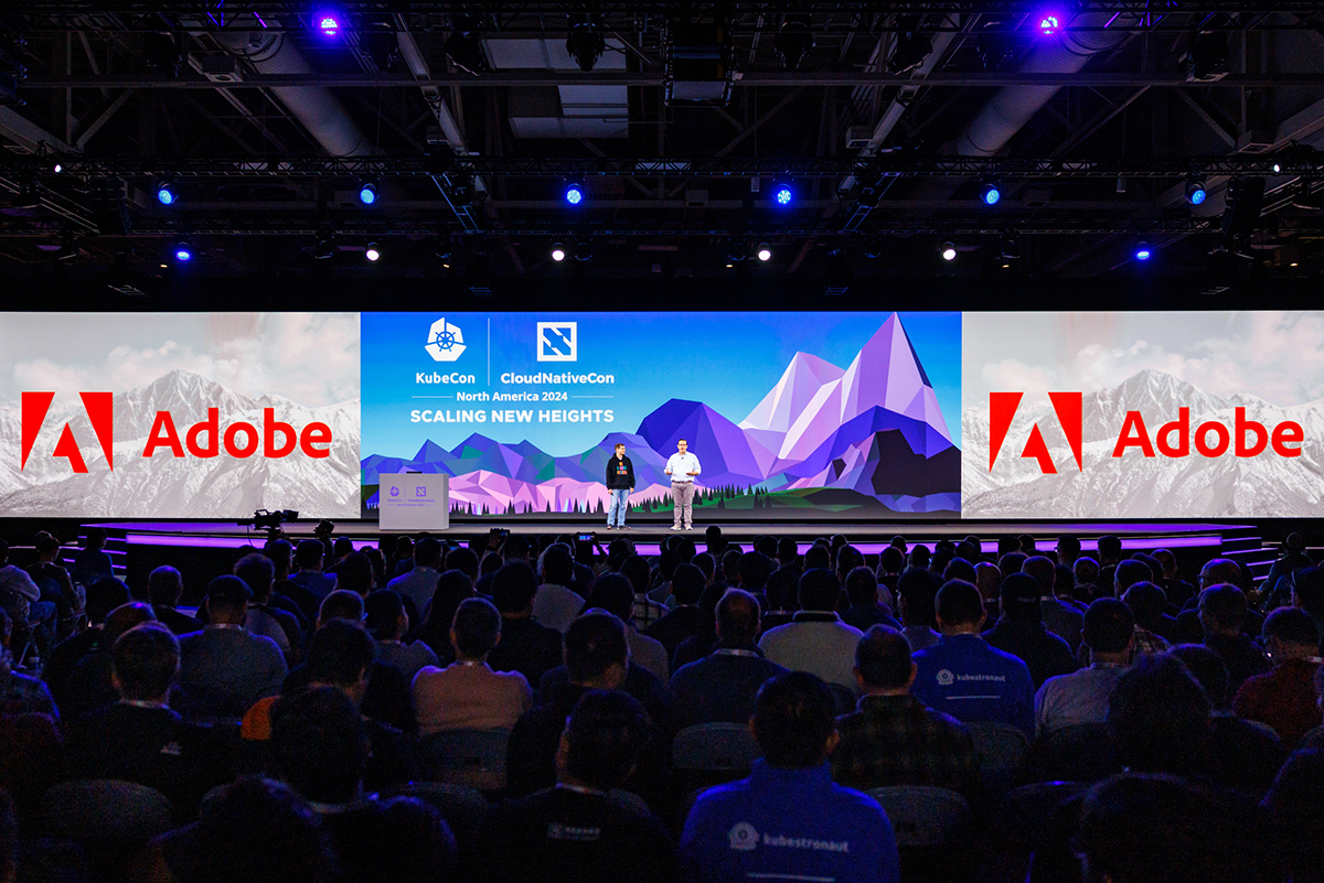 Adobe accepts the CNCF Top End User Award on the Keynote stage at KubeCon + CloudNativeCon North America 2024