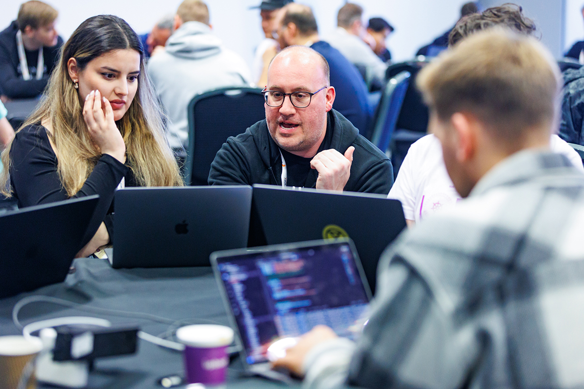 A room full of Backstage contributors addressing issues and building plugins